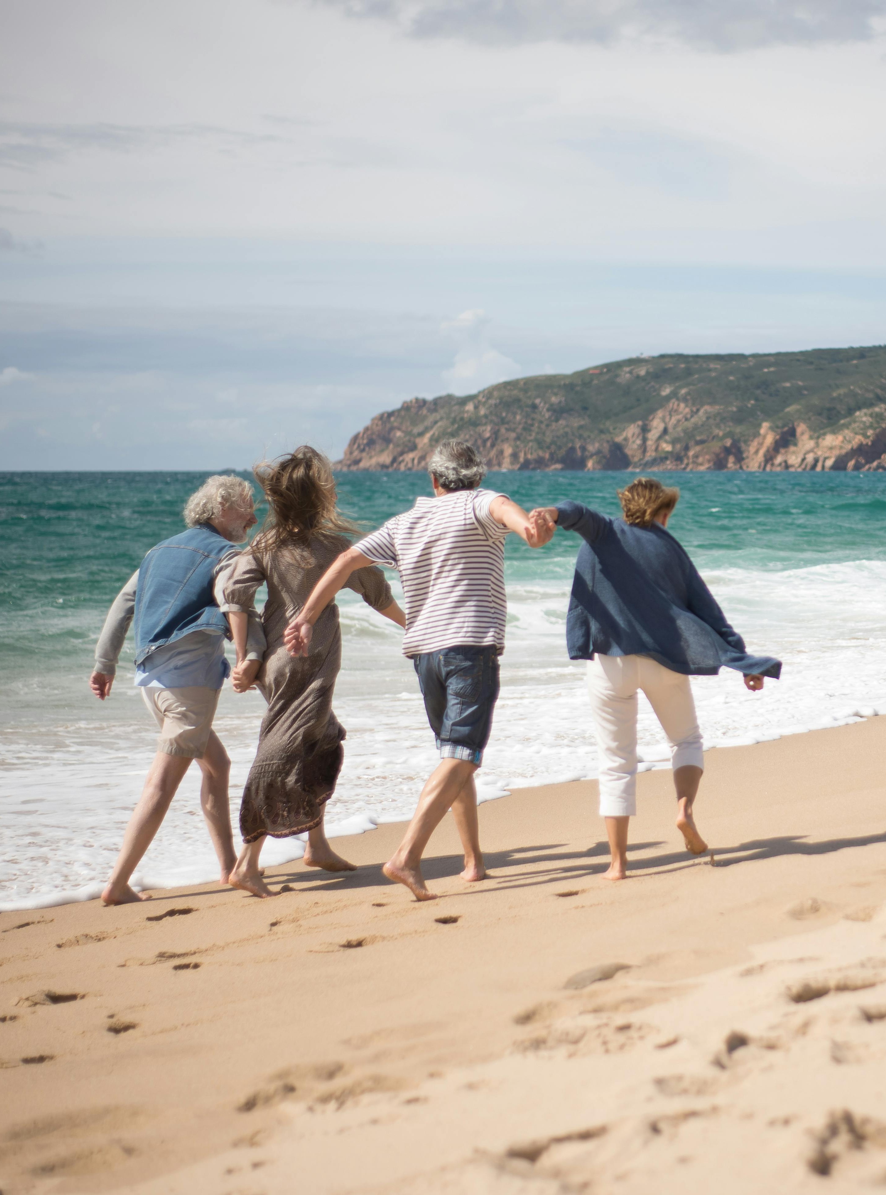 Seniors walking on beach